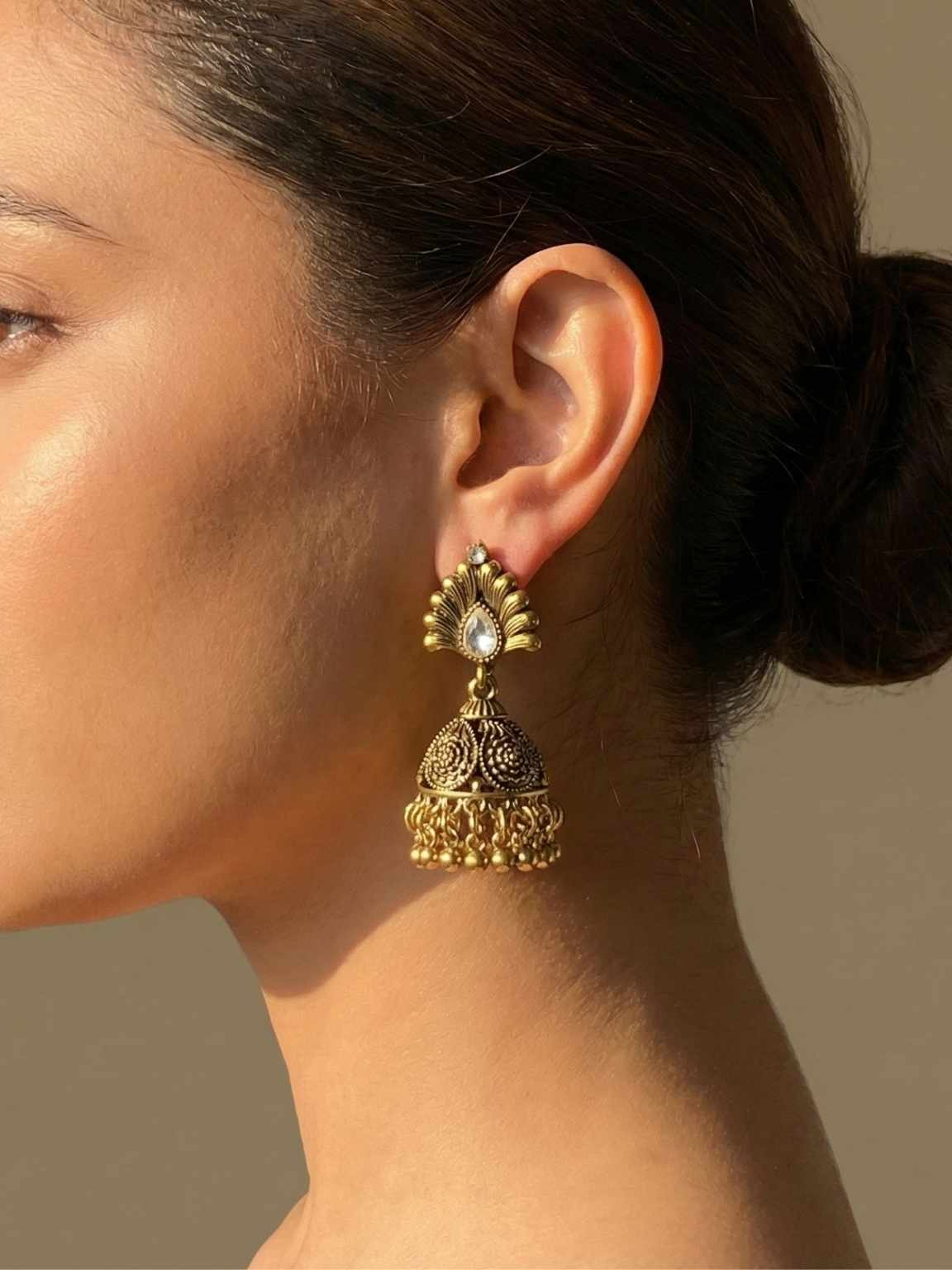 Antique Floral Dome Jhumkas with Stone-Studded Peacock Fan Design Antique Floral Dome Jhumkas with Stone-Studded Peacock Fan Design